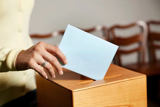 60c7c9d88b959f49d10ba3ca Woman Voting scaled 1